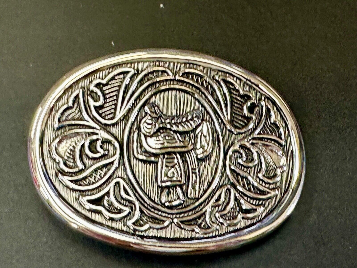 Vintage Cowboy's Horse Saddle ornate flower swirl oval belt buckle by Avon