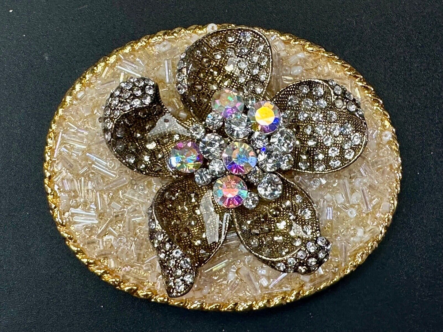 Beautiful chunky goldtone flower centerpiece in rhinestone accented belt buckle