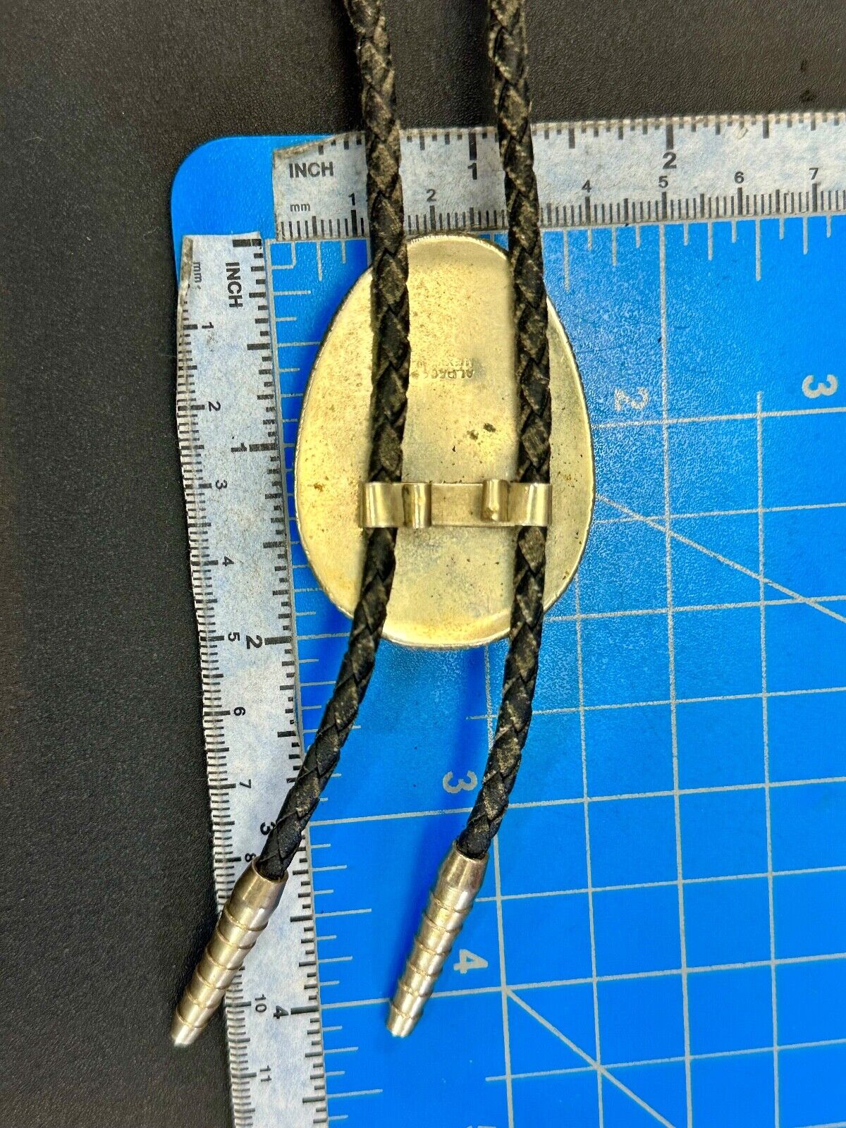 Beautiful Alpaca Mexico bolo tie with dimensional raised leaf's black stone
