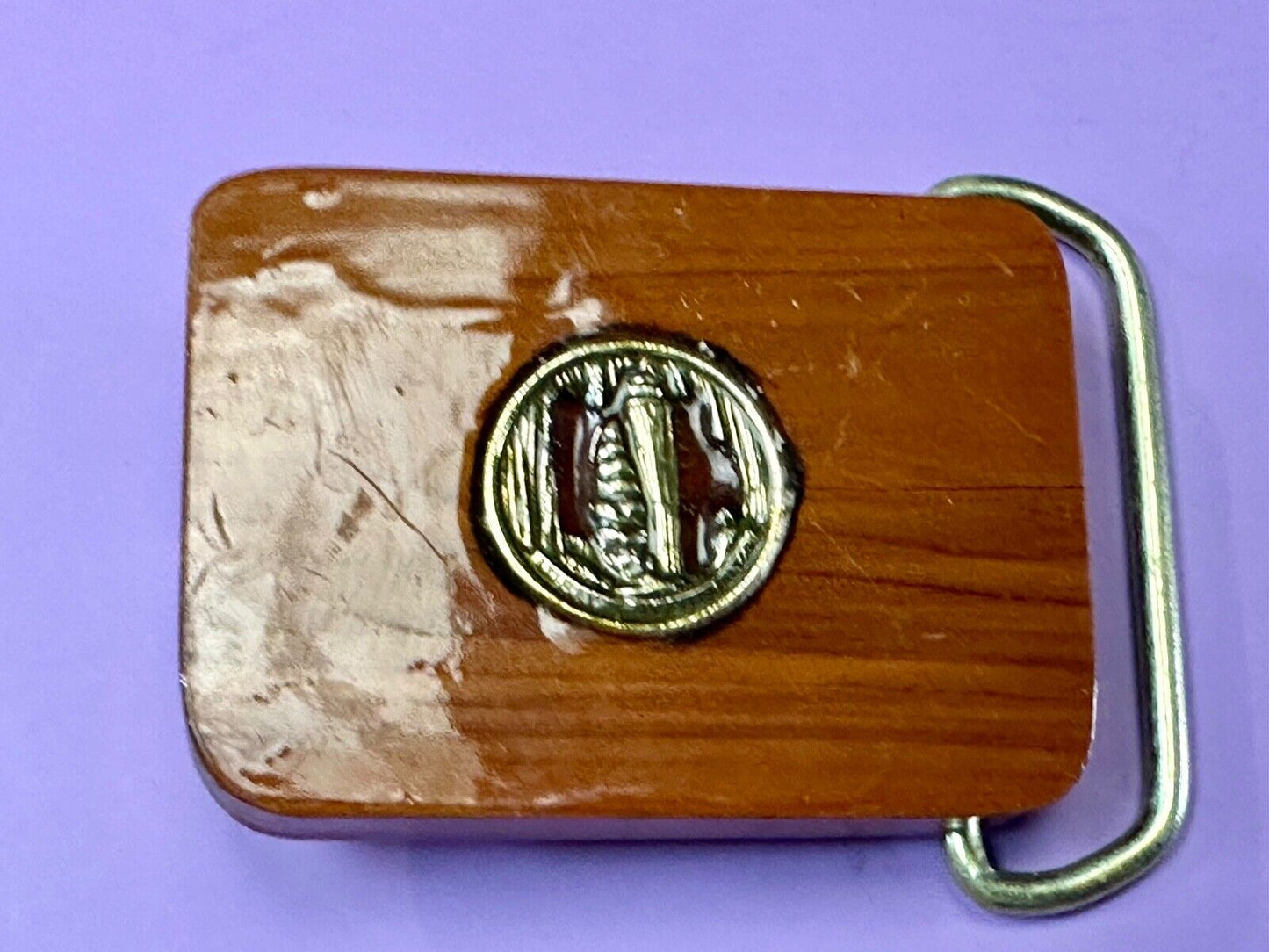 Artisan wood belt buckle with inlaid Luary Caverns cave token coin