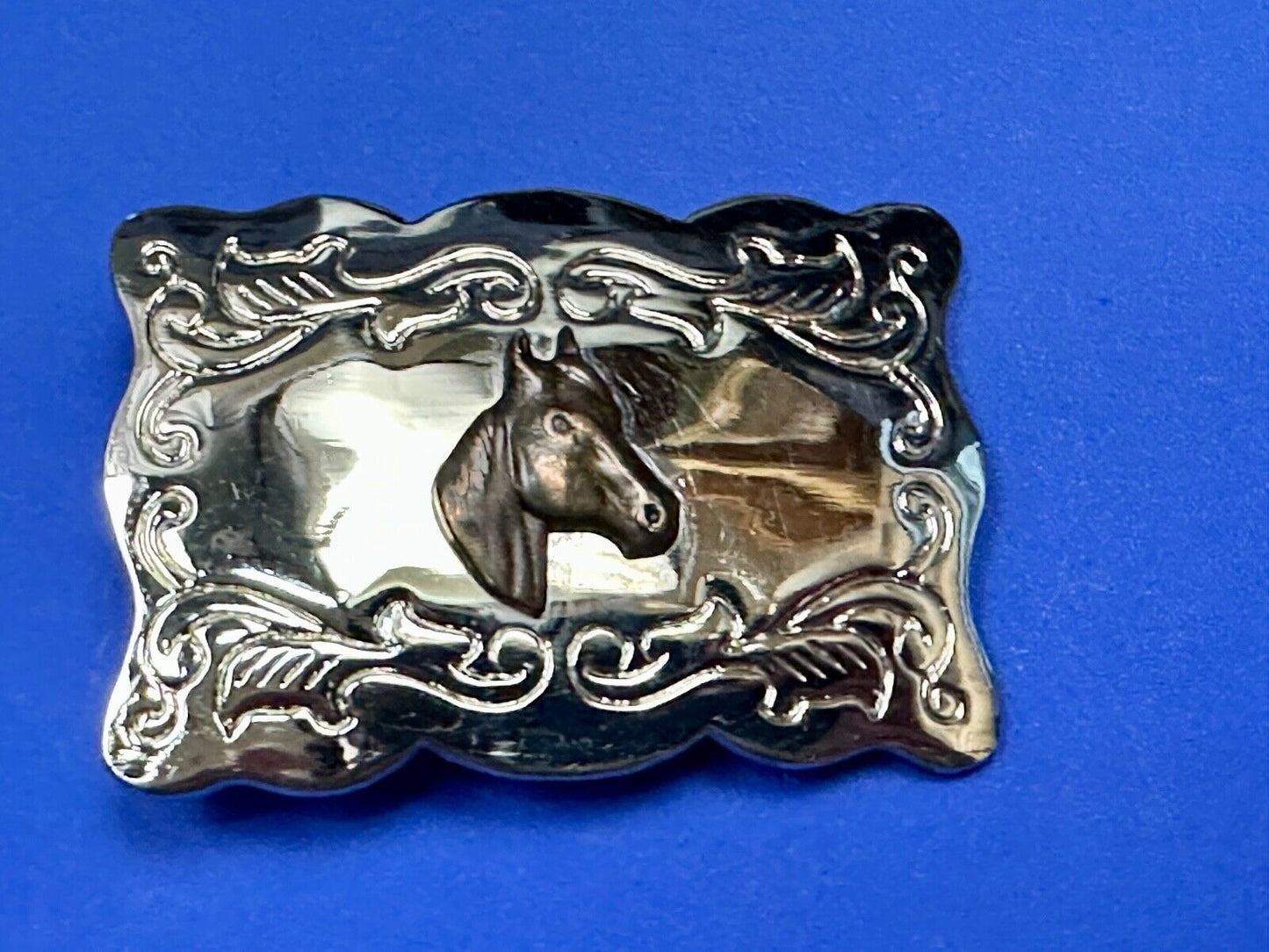 Vintage horse head centered on western rectangular two tone belt buckle