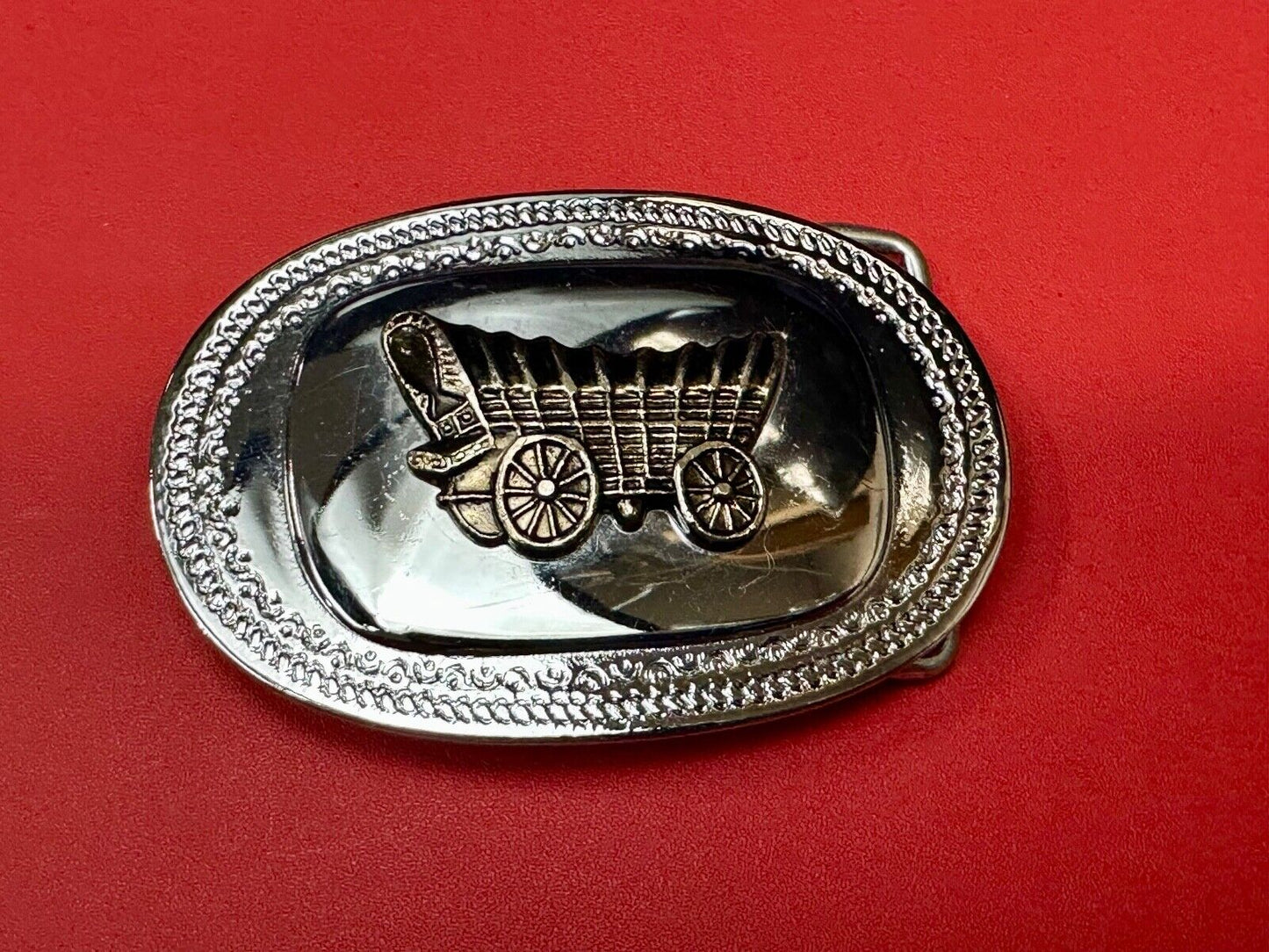 Vintage Covered Wagon on reflective oval two tone western belt buckle