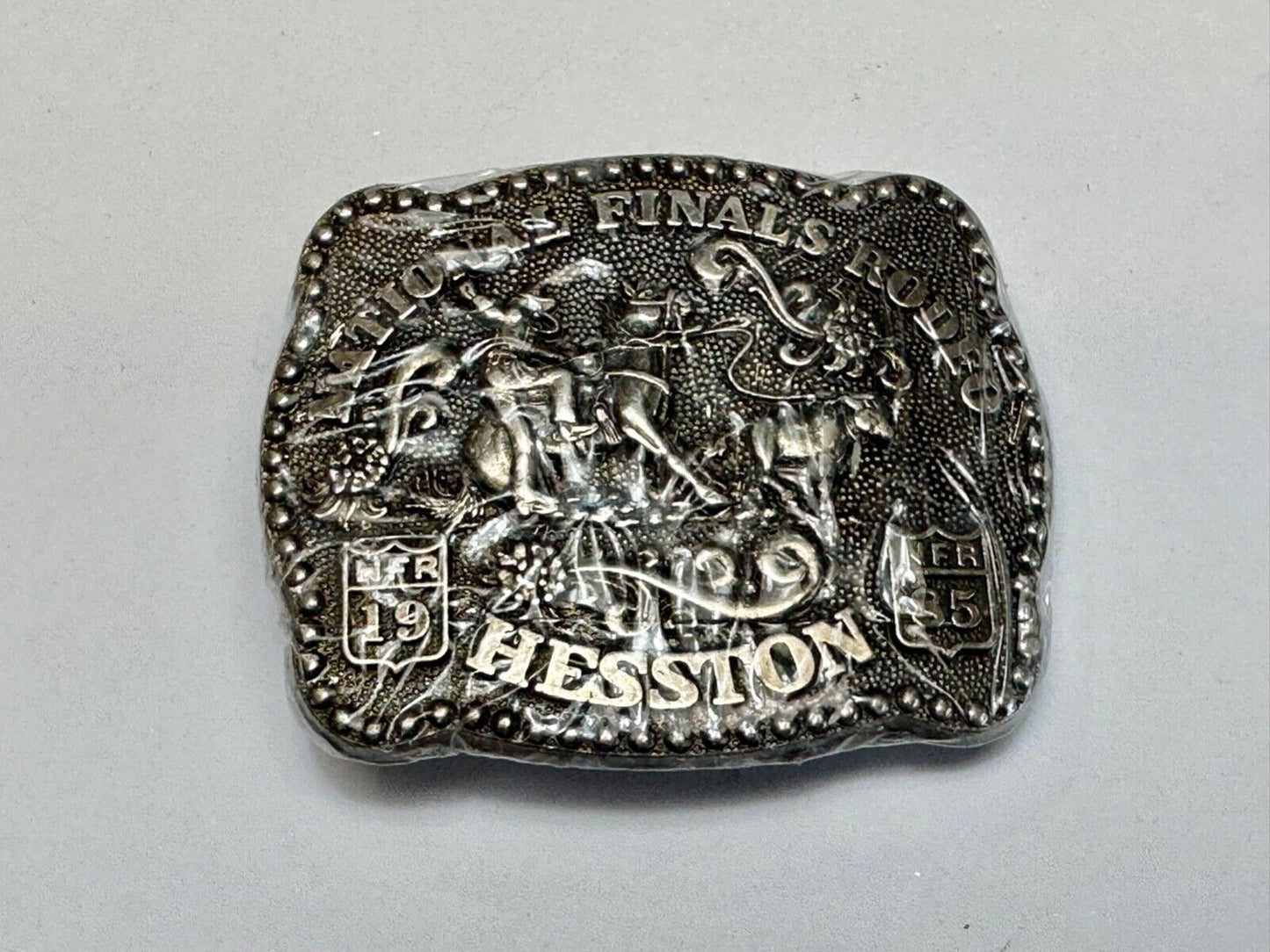 1985 Hesston Youth (small) NFR Belt Buckle in original shrink-wrap Third Eddn,