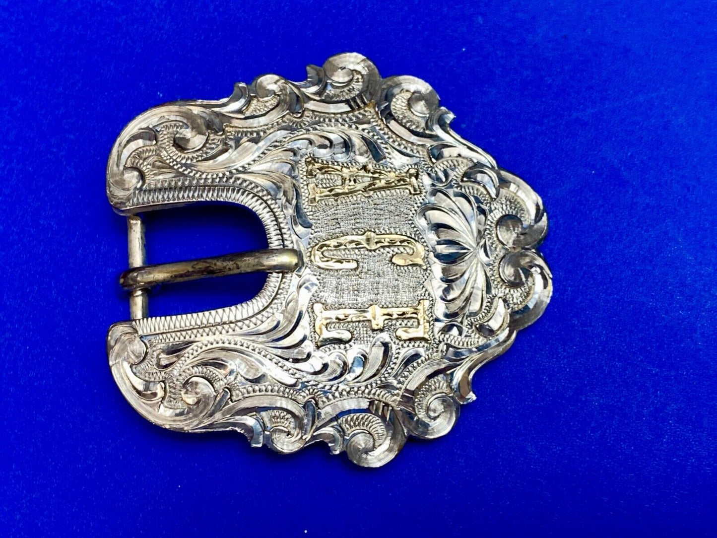 Vintage ACE Western cowboys flower swirl belt buckle design by DALE Chavez