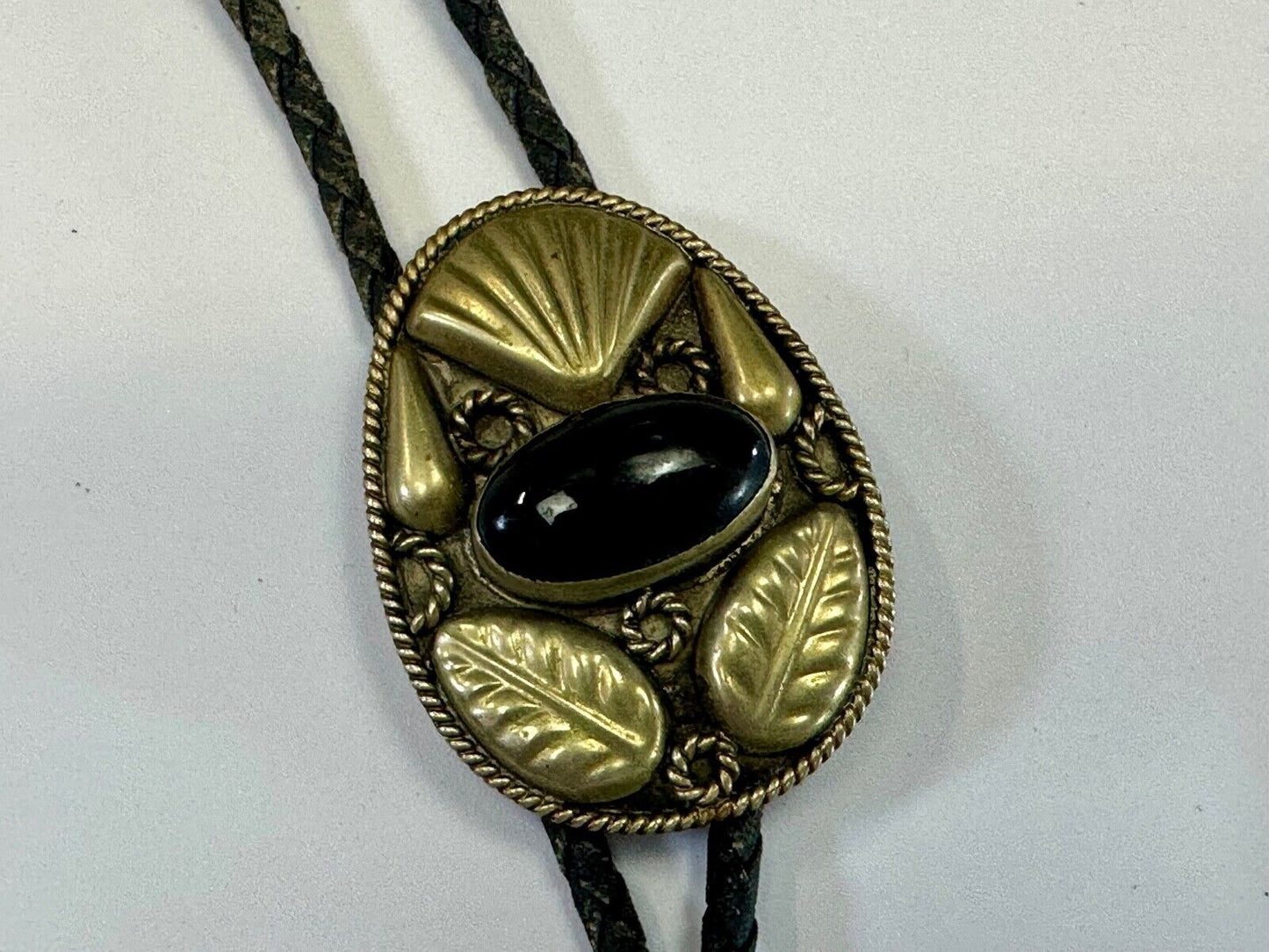 Beautiful Alpaca Mexico bolo tie with dimensional raised leaf's black stone