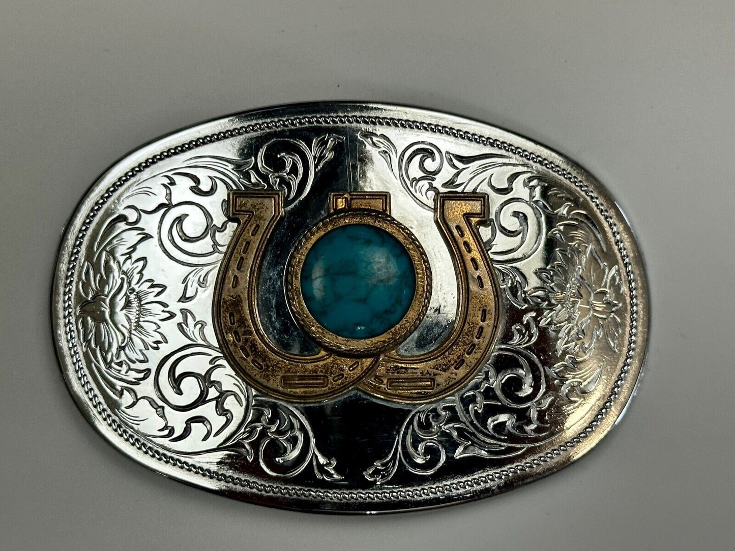 Turquoise centerpiece in lucky horseshoe - two tone reflective belt buckle