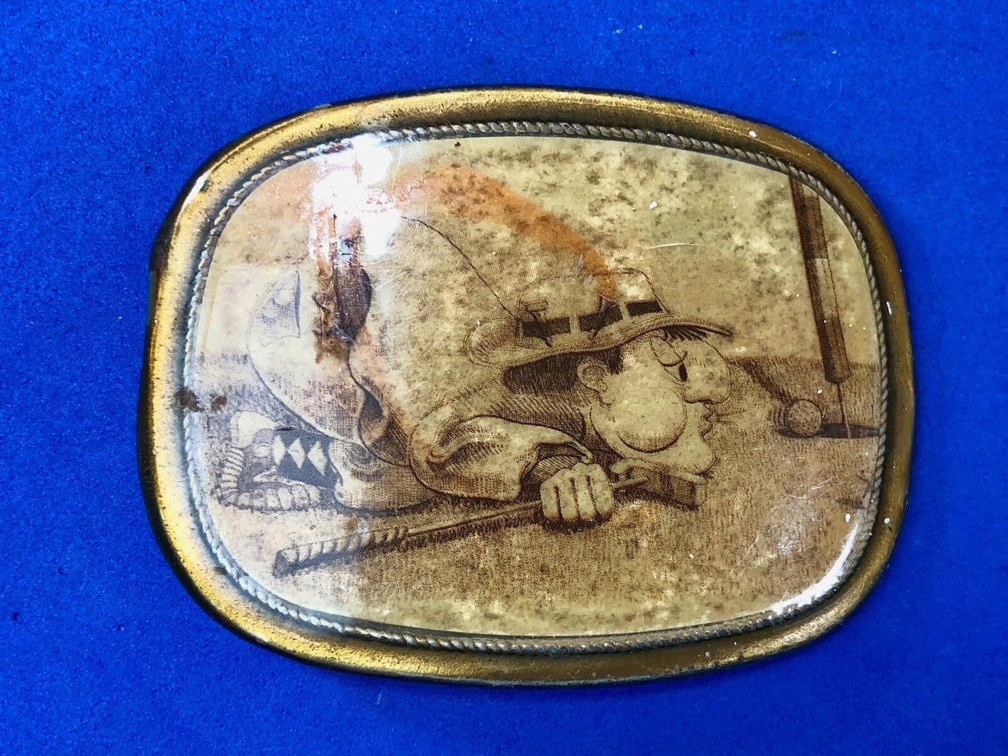 Vintage Belt Buckle, golf cartoon golfer on ground blowing ball into hole!