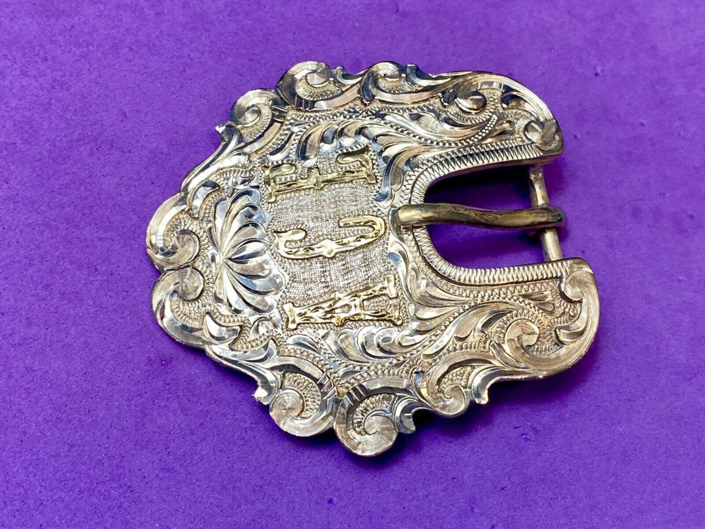 Vintage ACE Western cowboys flower swirl belt buckle design by DALE Chavez