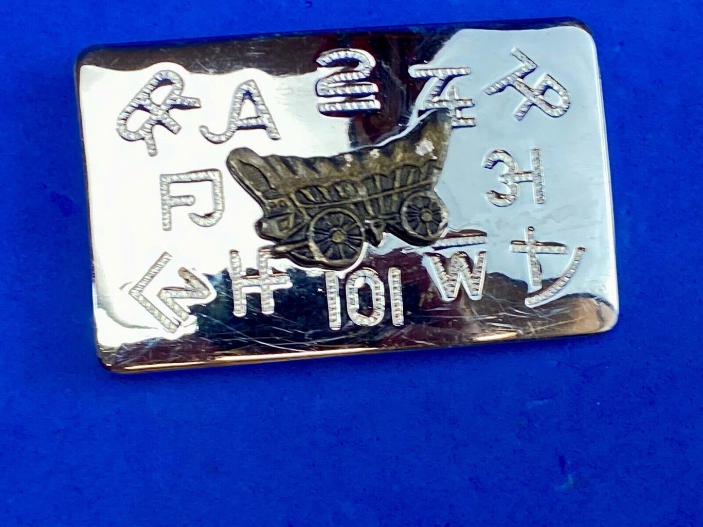 Vintage Chaimbers covered wagon western belt buckle with branding signs marks