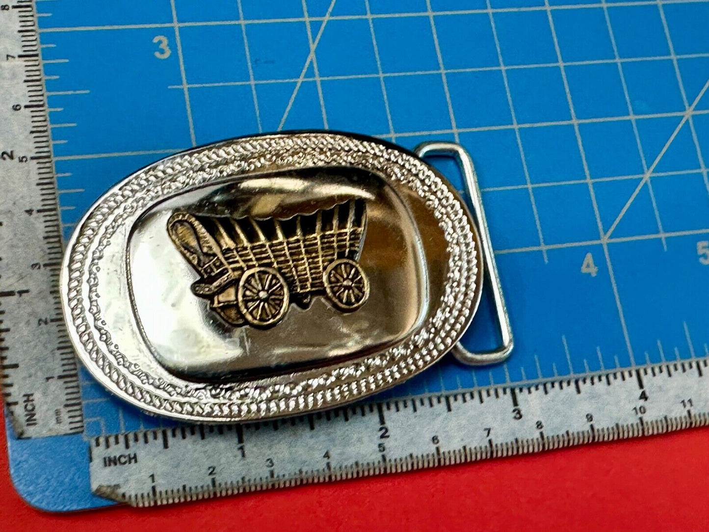 Vintage Covered Wagon on reflective oval two tone western belt buckle