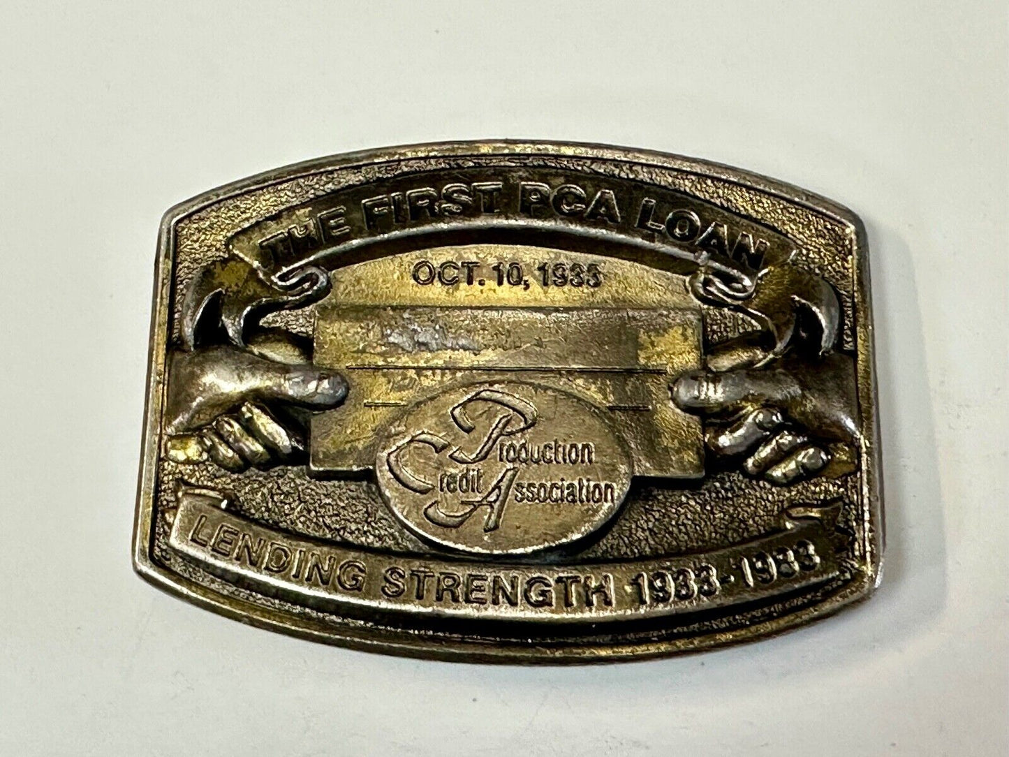 The First PCA loan Production Credit - Vintage The Great American Belt Buckle Co