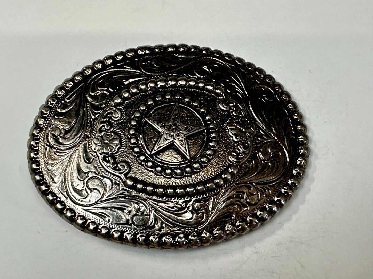 The Lone Star Centered In Oval Flower Swirl Silver Tone Belt Buckle