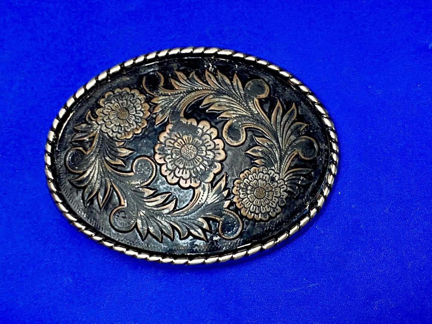 Beautiful flower design black & copper color oval outlined western belt buckle W