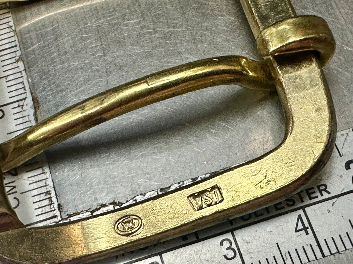 Vintage replacement belt buckle marked W with unique angle