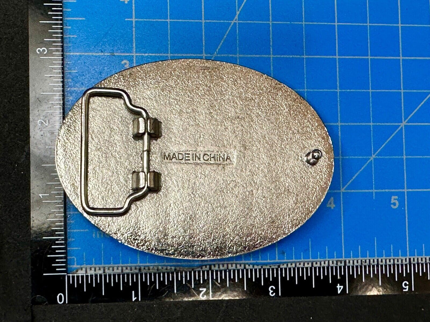 Black and silver Belt Buckle with multiple skulls on boarder