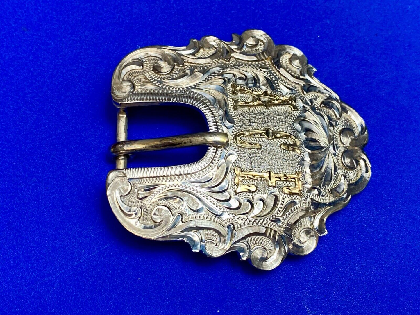Vintage ACE Western cowboys flower swirl belt buckle design by DALE Chavez