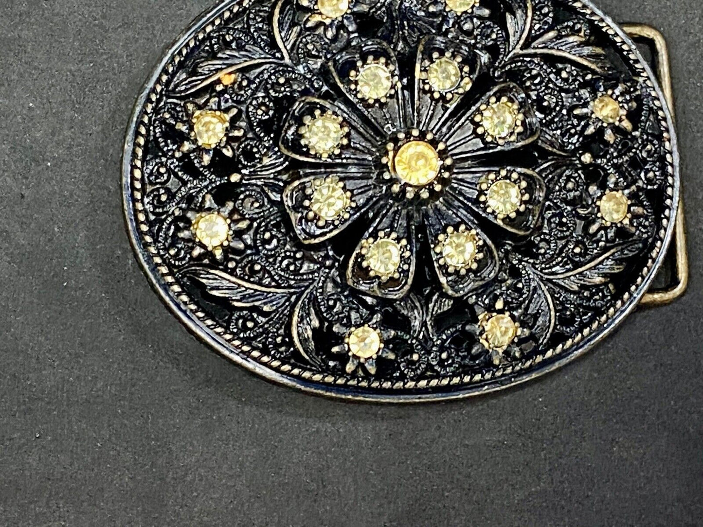 BEAUTIFUL Yellow rhinestones mounted in oval shaped flower theme belt buckle