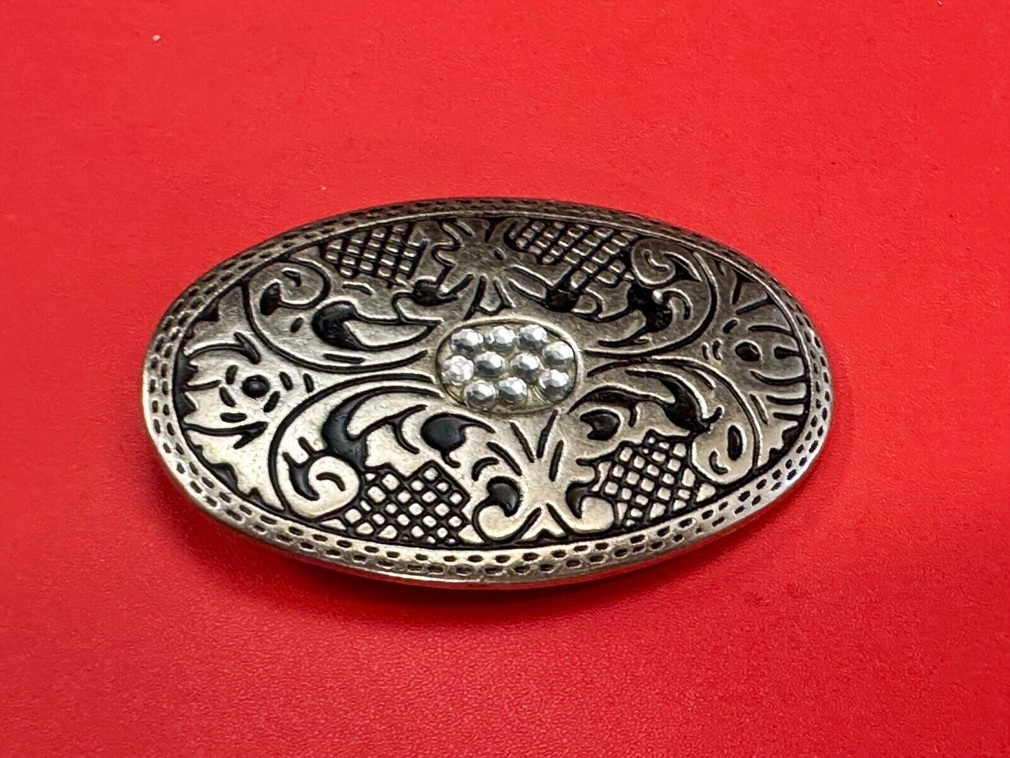 Vintage Cluster Centered in southwestern pattern oval belt buckle