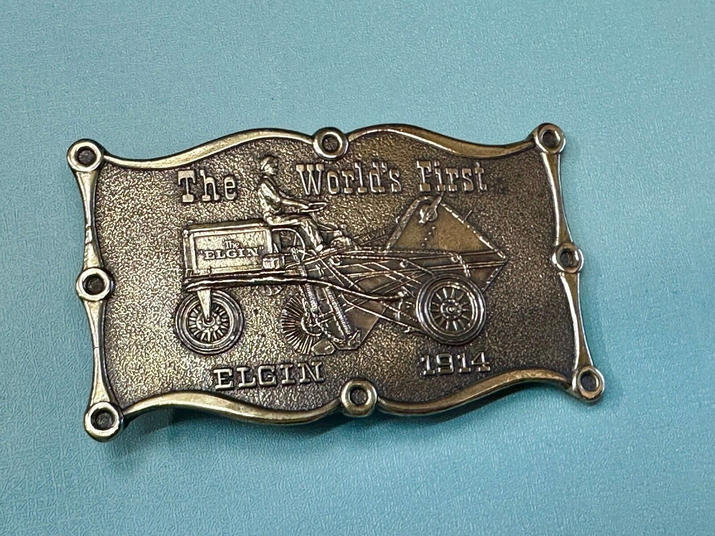 The Elgin, The worlds first tree sweeper commemorative belt buckle by Lewis