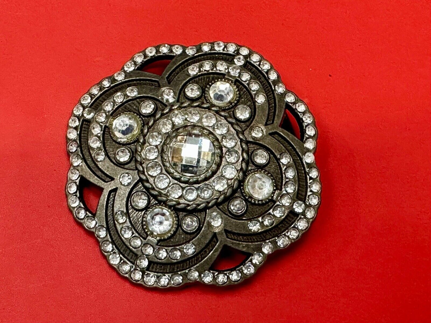 Beautiful Rhinestone accented see through flower shaped cutout belt buckle