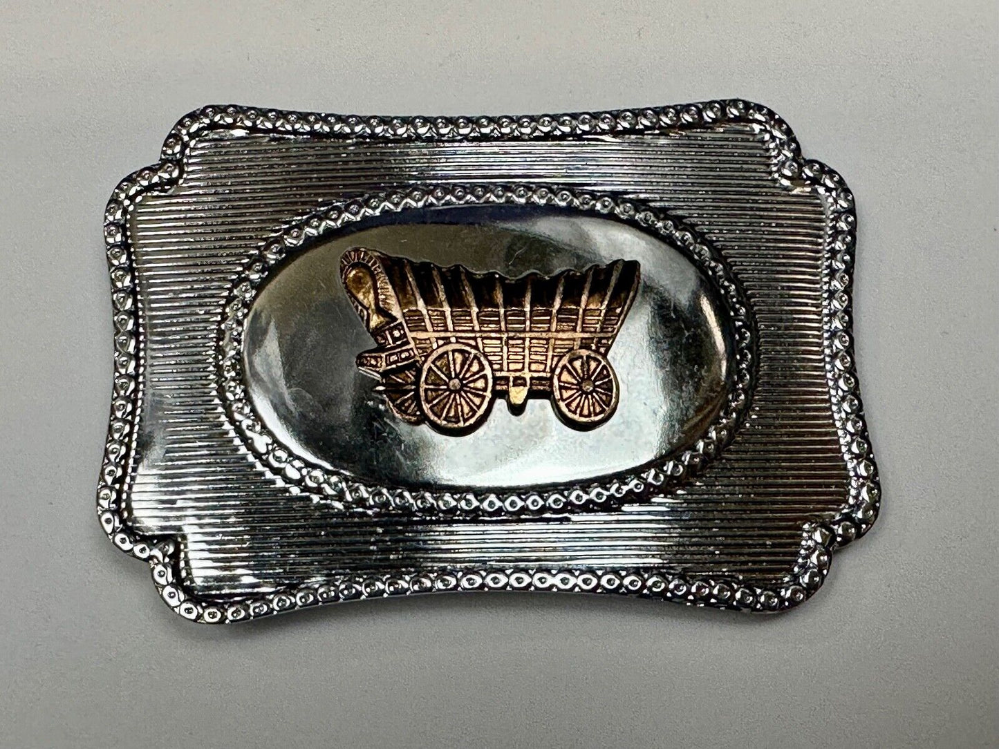 Vintage covered wagon western horse drawn transportation belt buckle
