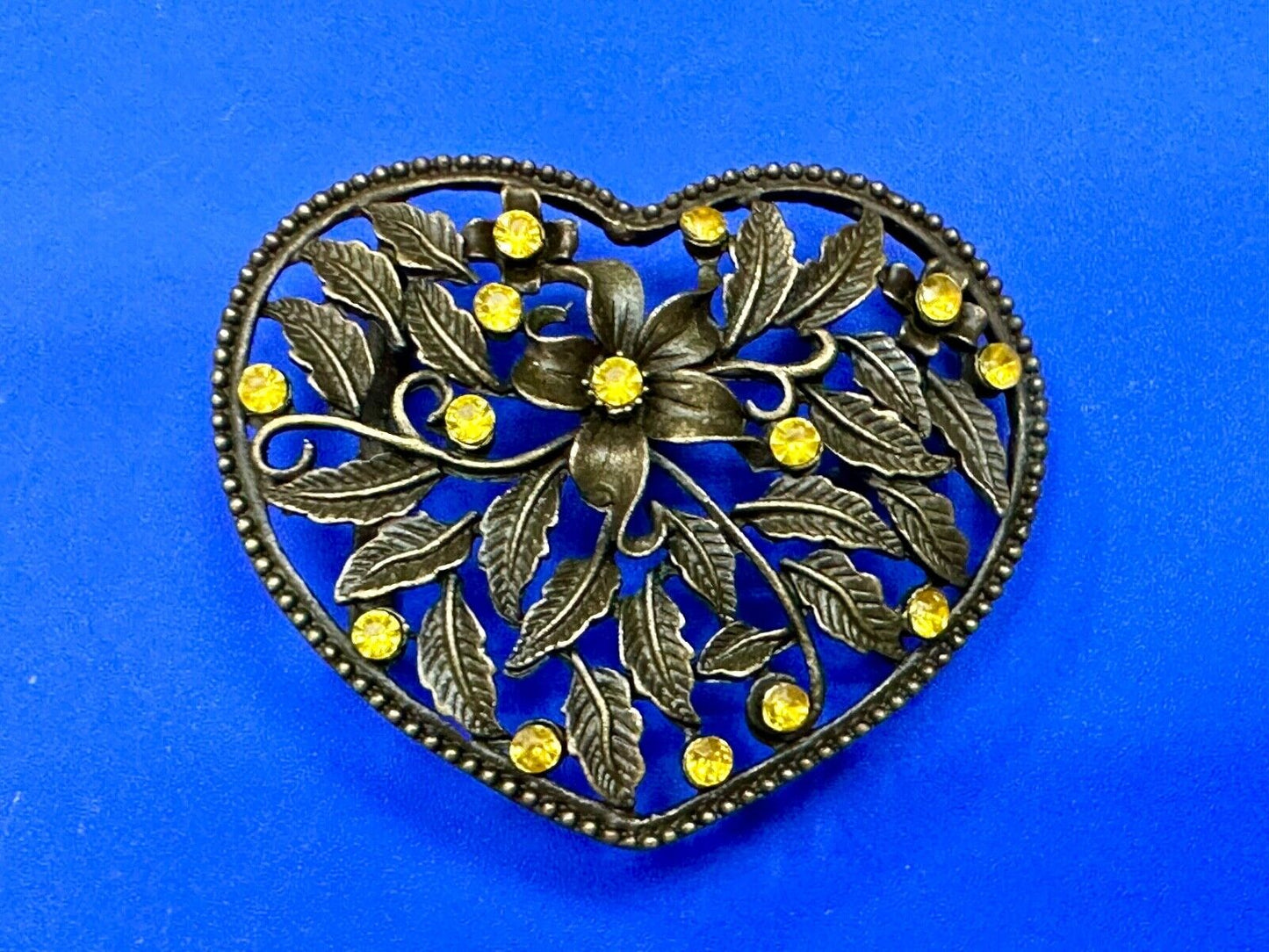 Beautiful see through Heart shaped belt buckle with yellow rhinestone accents