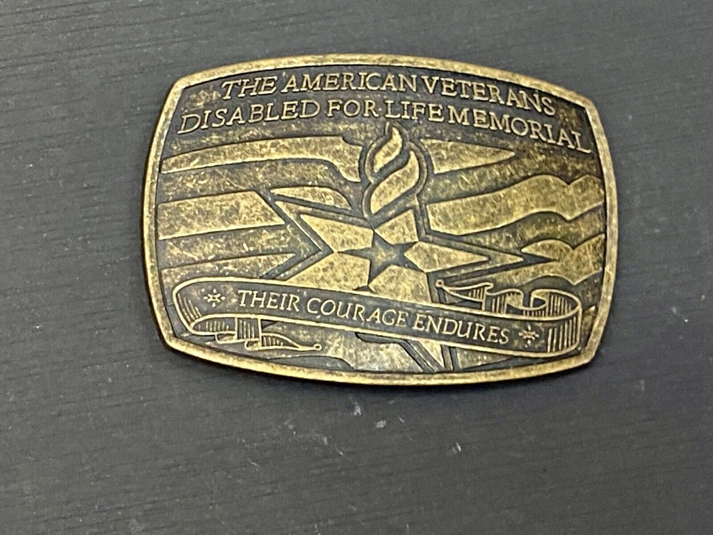 The American Disable Veteran Memorial Belt Buckle Their Courage Endures.