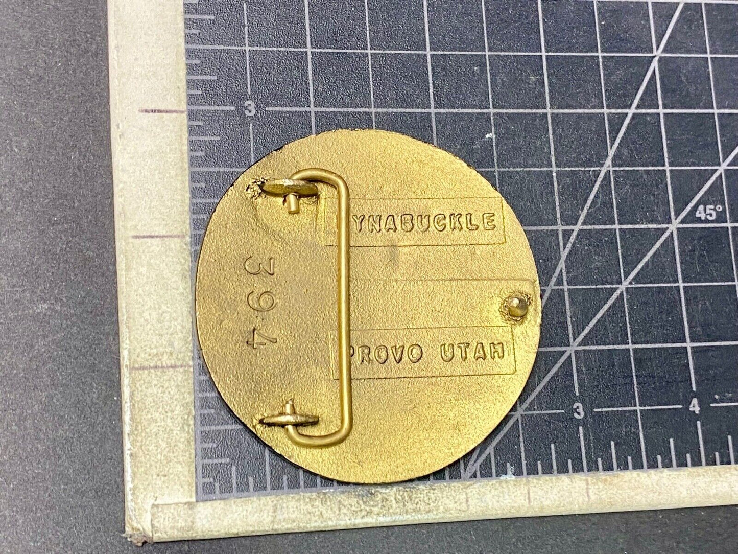 Astralloy Vis a unique, deep-air hardened steel promotional brass belt buckle