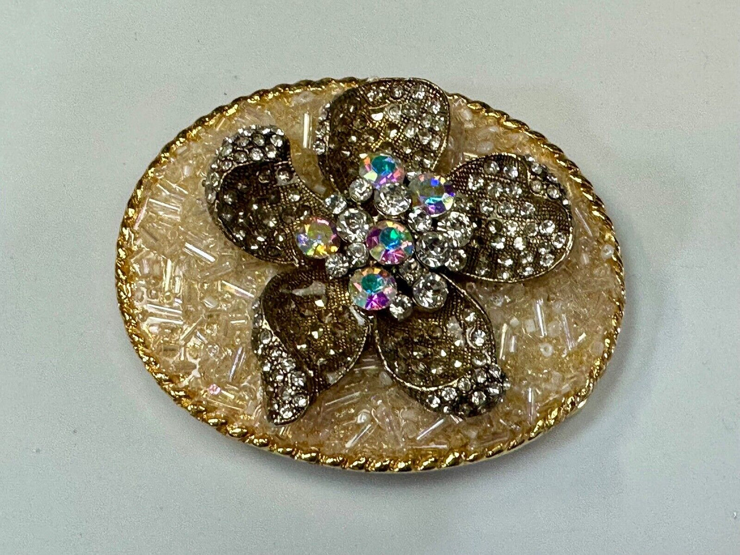 Beautiful chunky goldtone flower centerpiece in rhinestone accented belt buckle