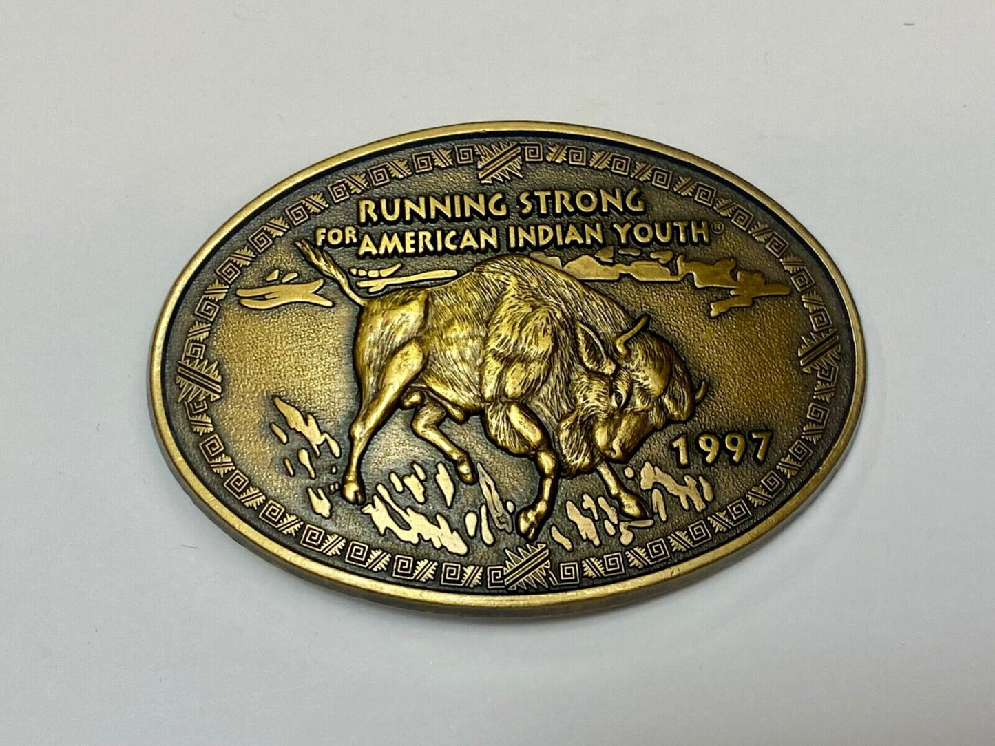 Vintage 1997 BUFFALO belt buckle RUNNING STRONG FOR AMERICAN INDIAN YOUTH