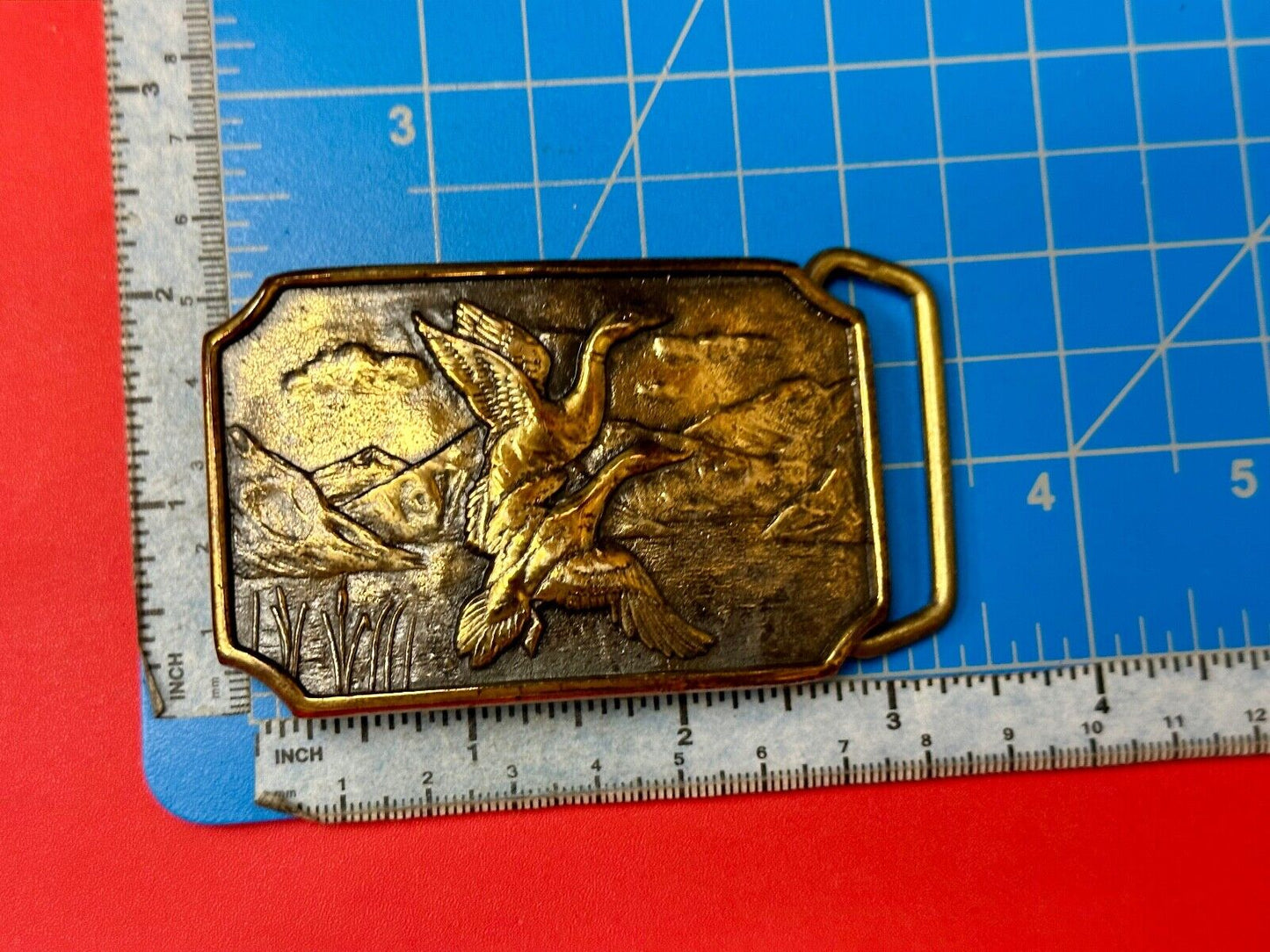 Two ducks flying from pond cat tails Nature Solid Brass belt buckle by BTS