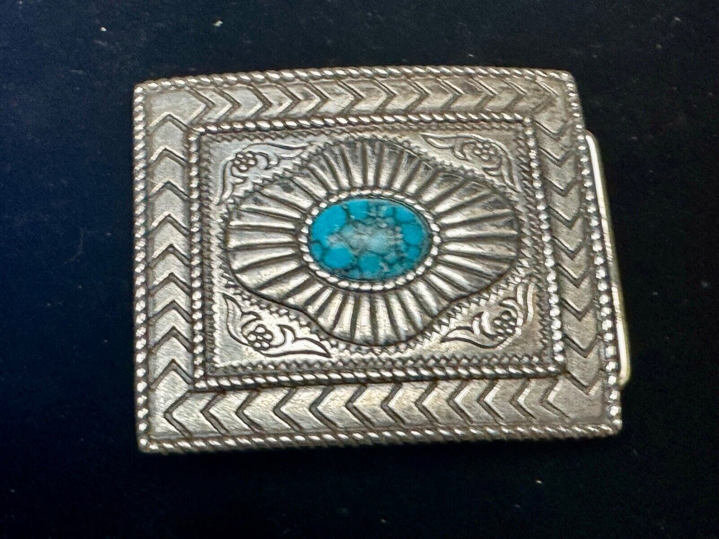 Turquoise Cab centerpiece on southwestern pattern silver tone belt buckle