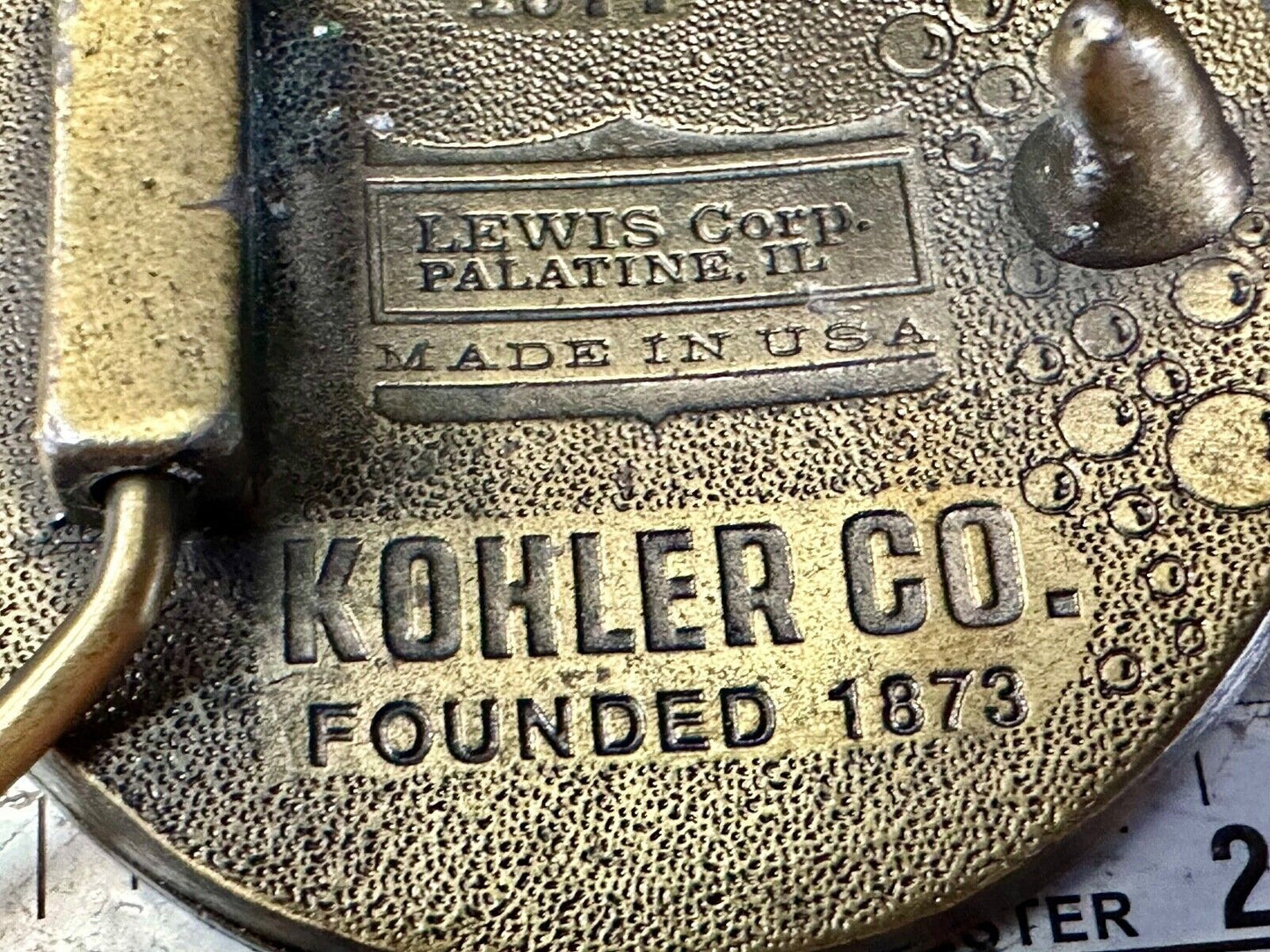 The Bold Look of Kohler Vintage 1977 Lewis round Limited Edition belt buckle