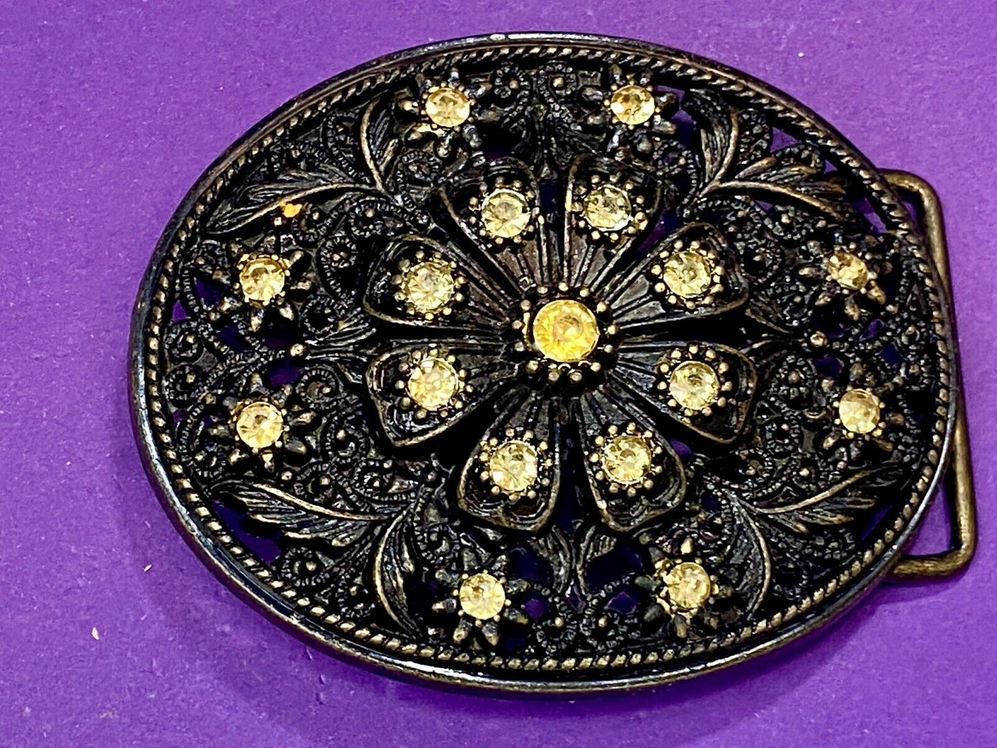 BEAUTIFUL Yellow rhinestones mounted in oval shaped flower theme belt buckle