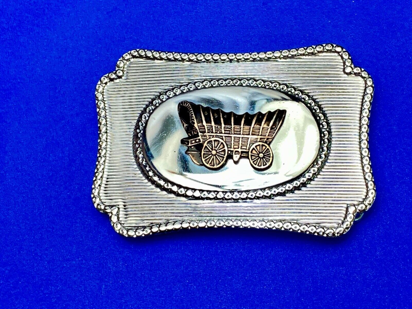 Vintage Covered wagon two tone reflective pre loved, western framed belt buckle