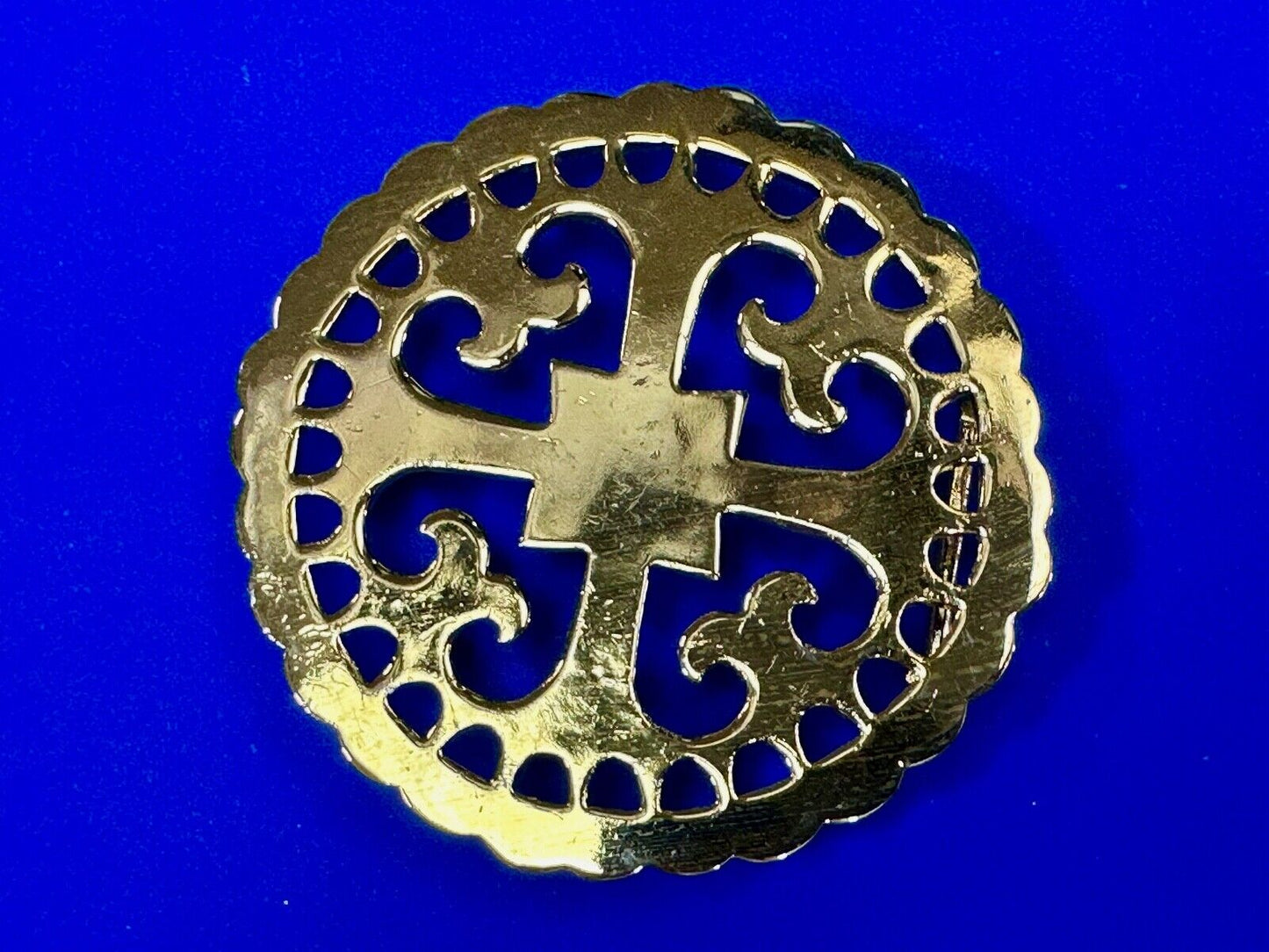 vintage Celtic pattern round cutout belt buckle by designer Ann Lansing