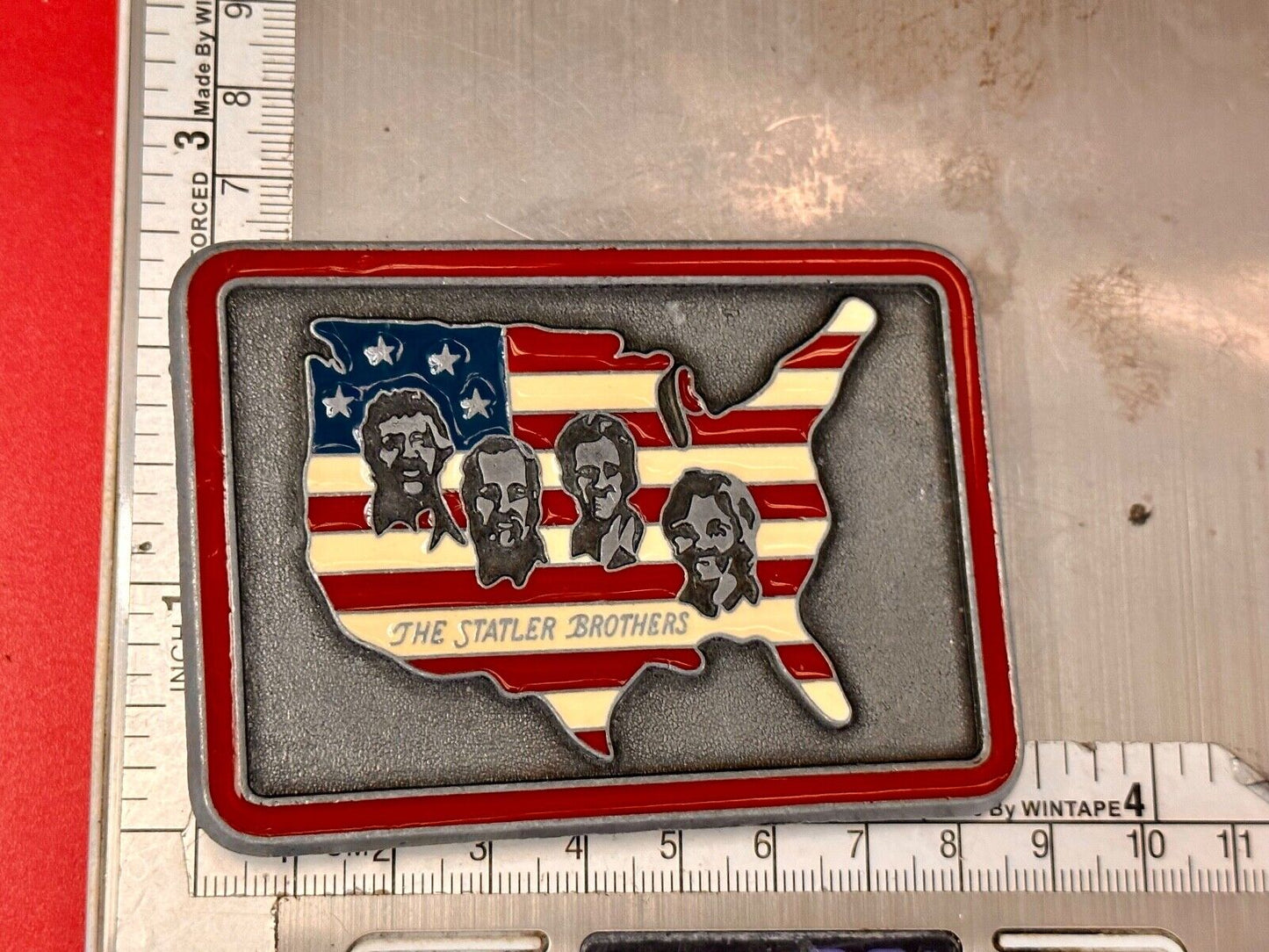 The Statler Brothers American Flag Country Shaped background band belt buckle