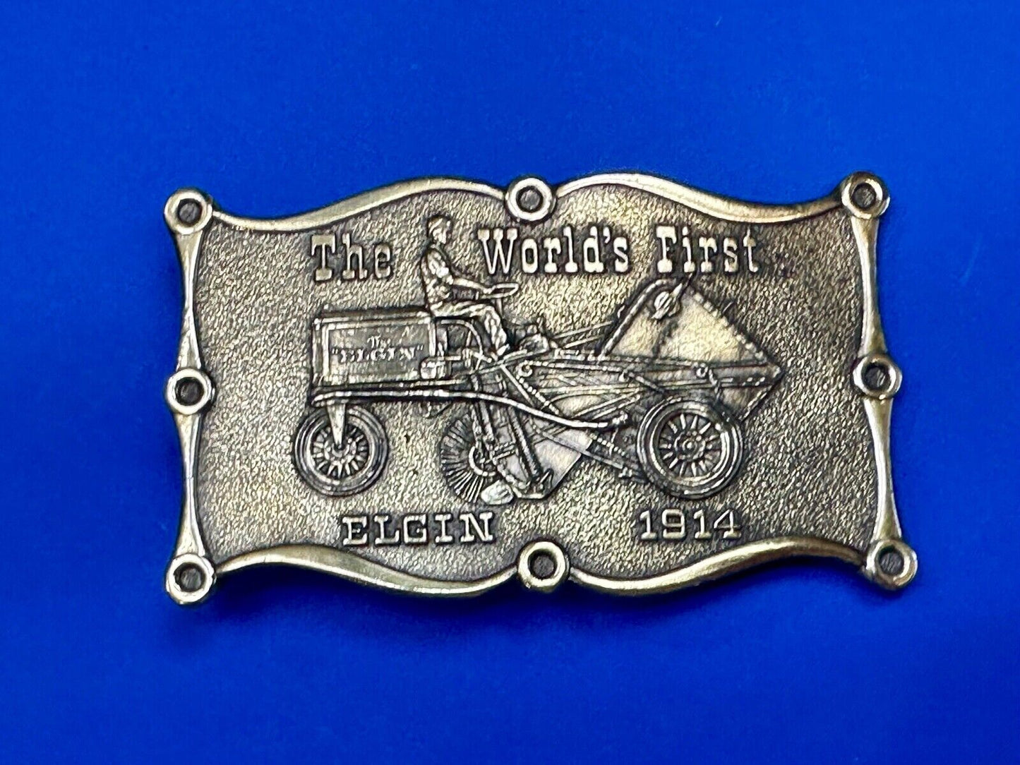 The Elgin, The worlds first tree sweeper commemorative belt buckle by Lewis