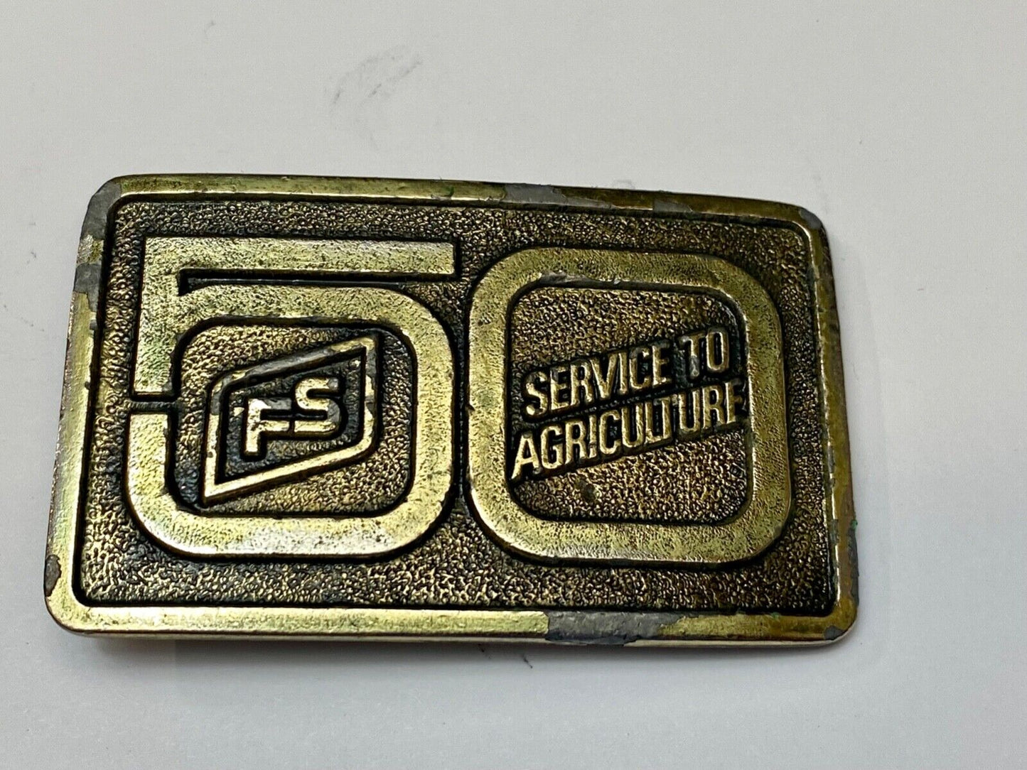 50 years, Farm Service to Agriculture belt buckle by Wyoming Studio Art works
