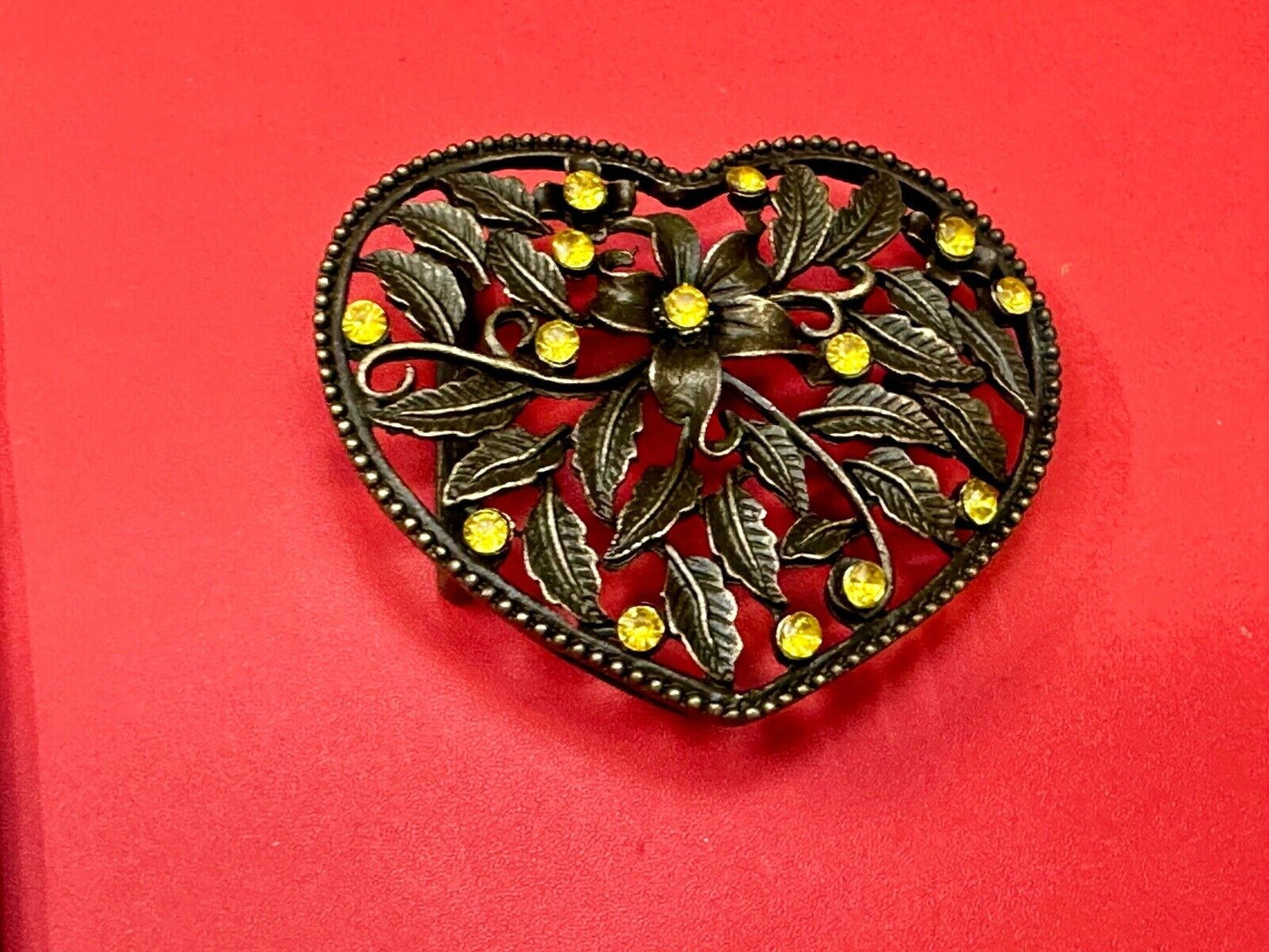 Beautiful see through Heart shaped belt buckle with yellow rhinestone accents