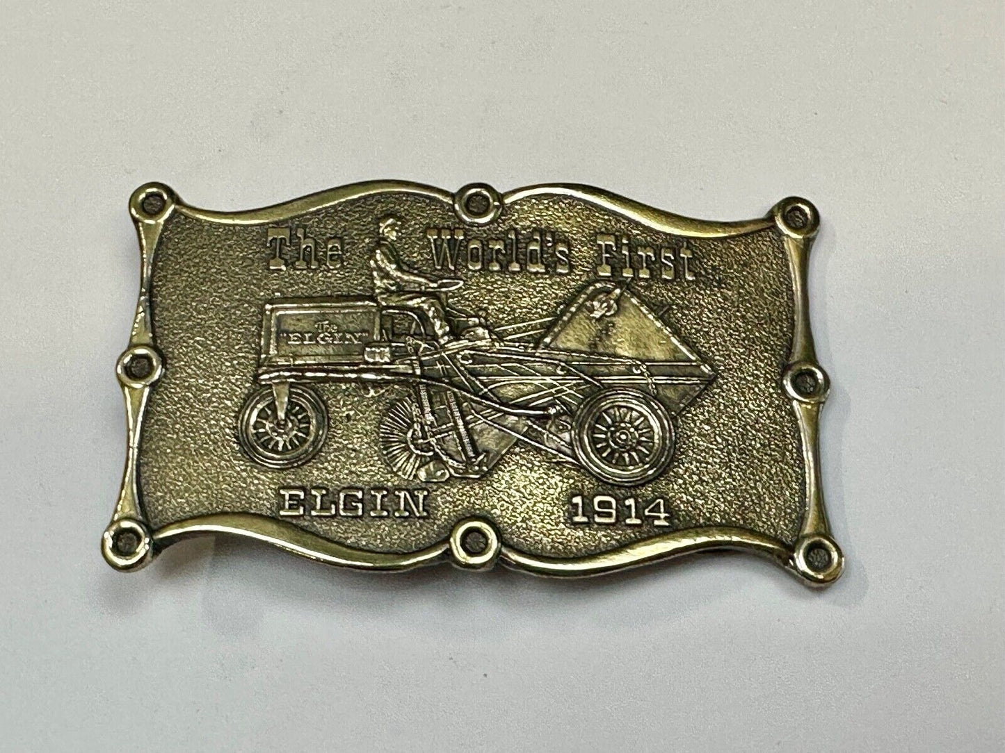 The Elgin, The worlds first tree sweeper commemorative belt buckle by Lewis