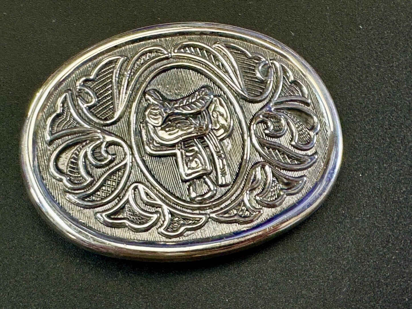 Vintage Cowboy's Horse Saddle ornate flower swirl oval belt buckle by Avon