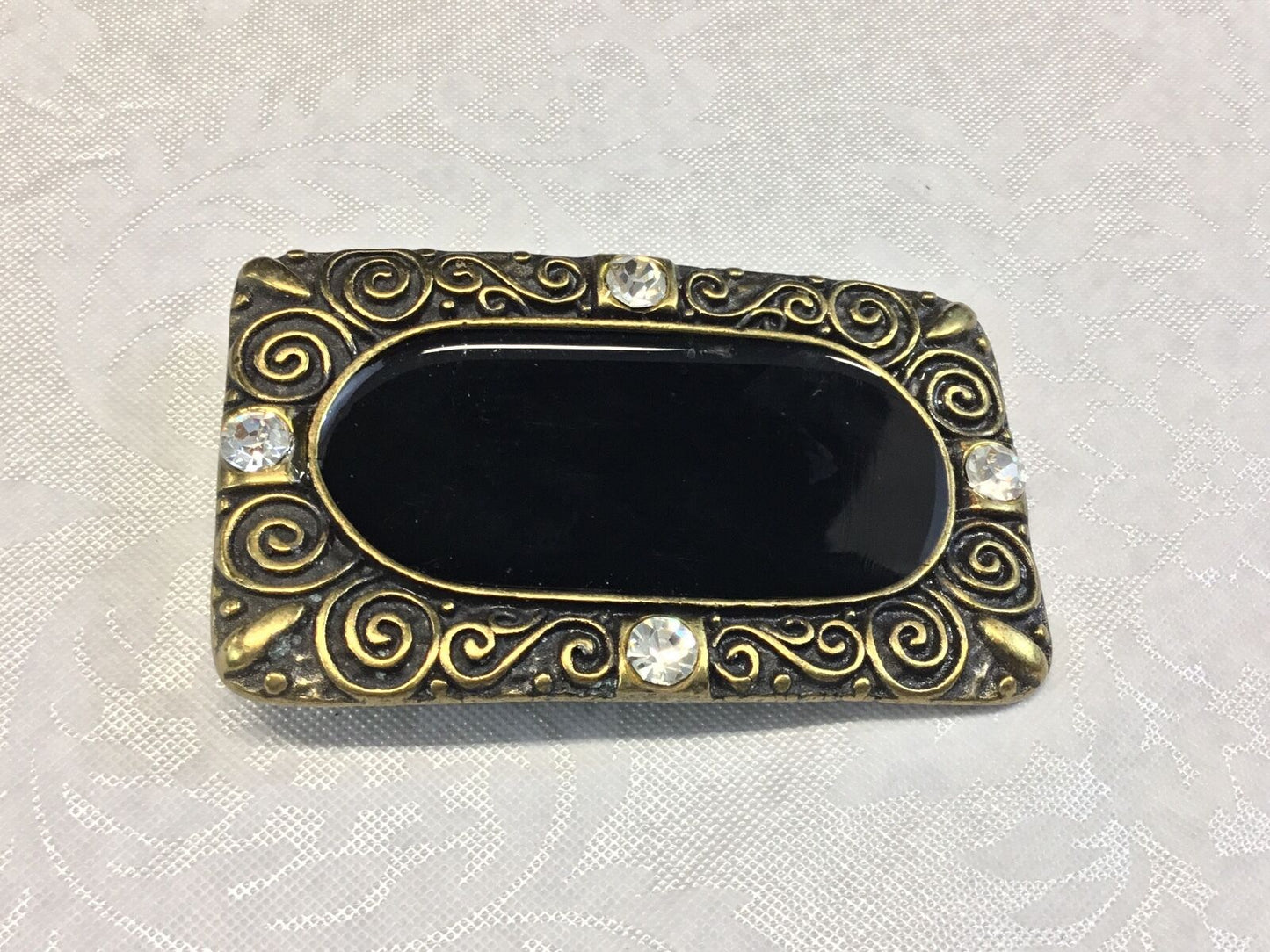 3.5". Designer / western / dress / Black and brass tone rhinestone belt buckle