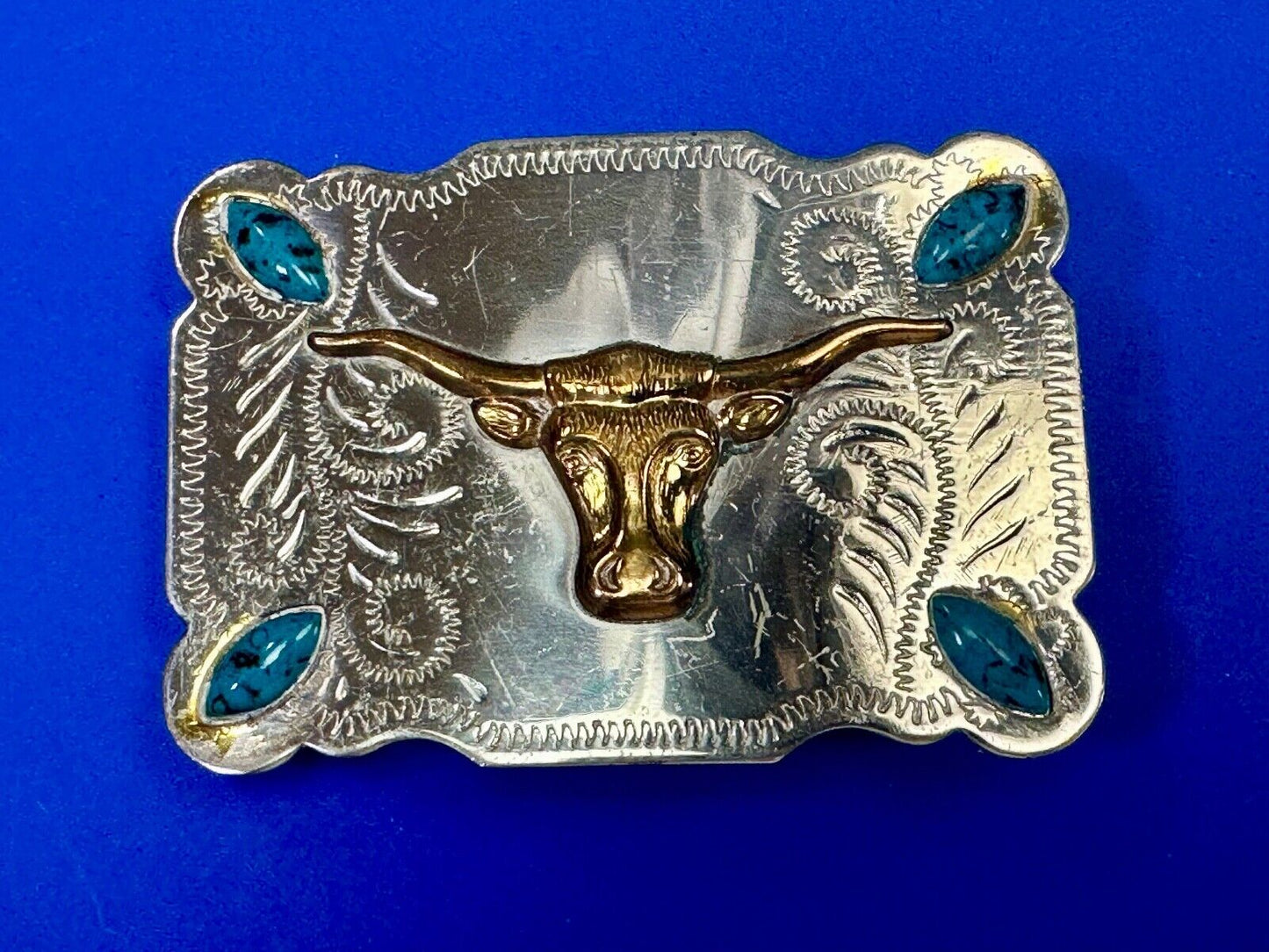 The Longhorn cow steer western nickel silver belt buckle with turquoise accents