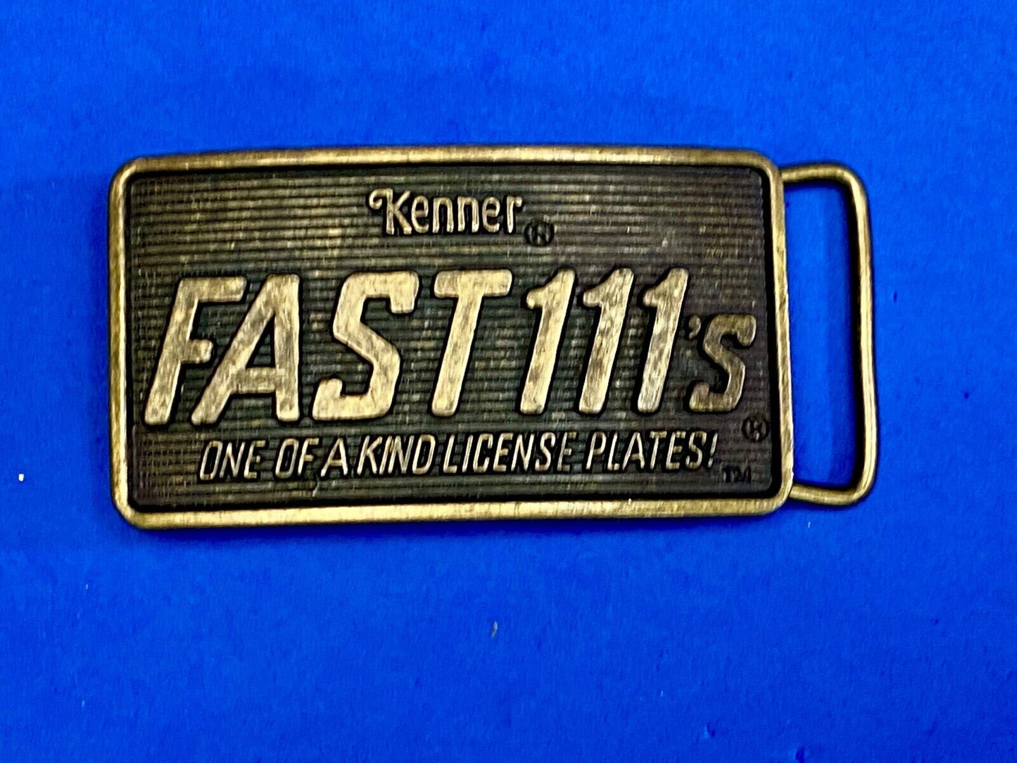 1982 Kenner Fast 111'S Company Advertisement Belt Buckle License Plates