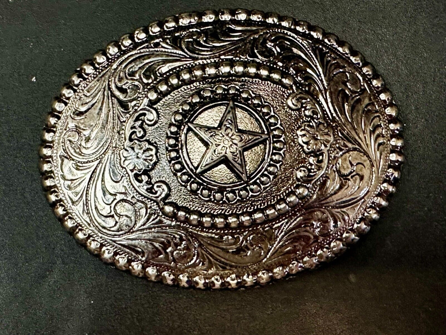 The Lone Star Centered In Oval Flower Swirl Silver Tone Belt Buckle