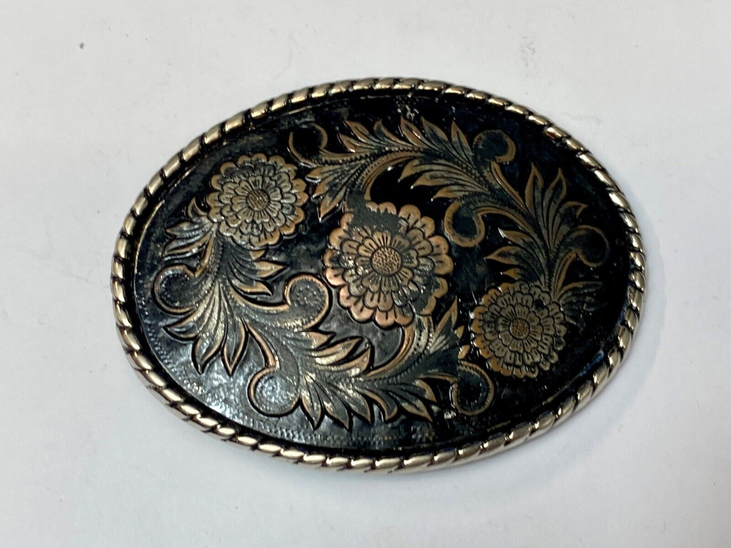 Beautiful flower design black & copper color oval outlined western belt buckle W