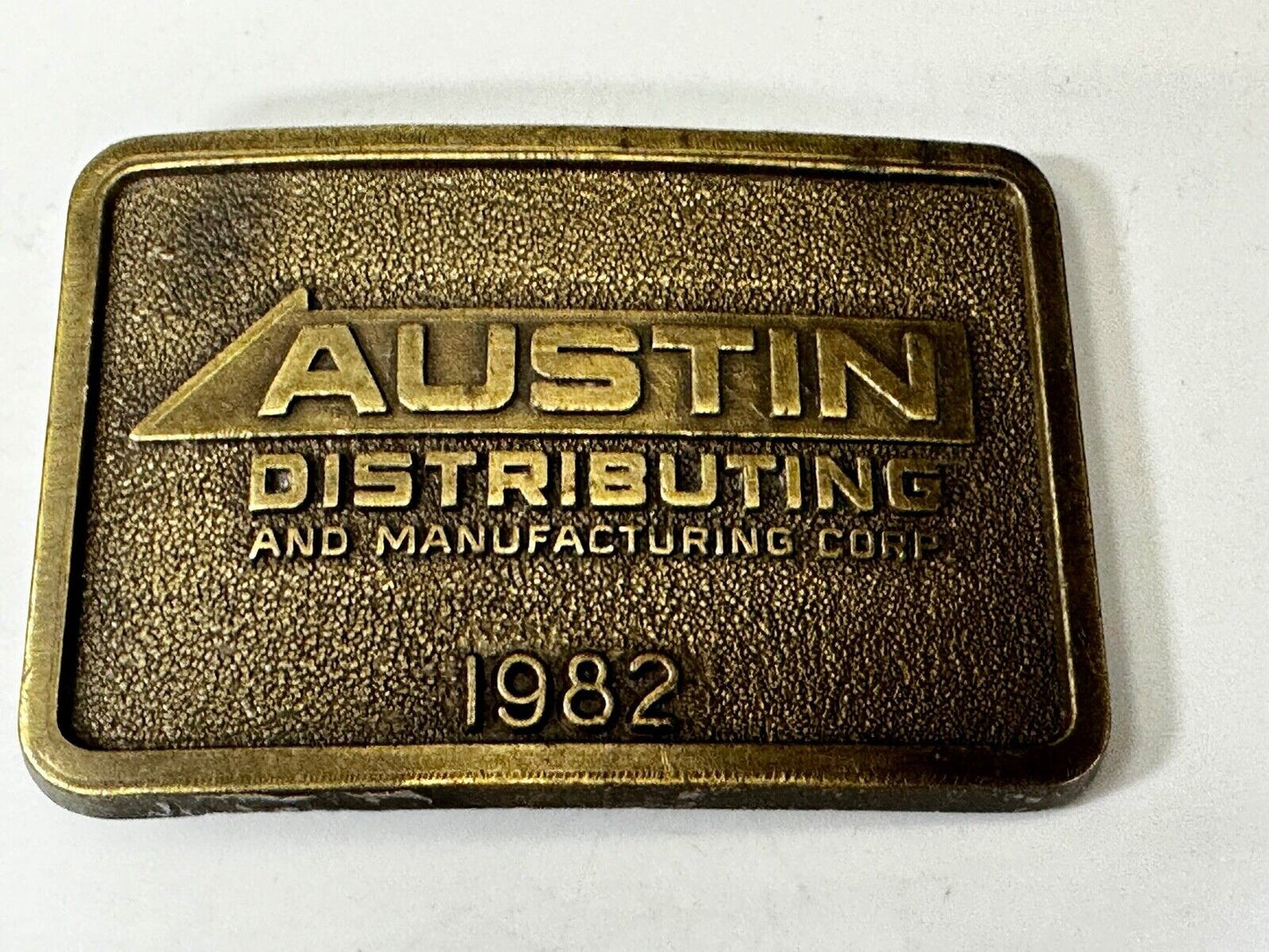 Austin Texas Distributing and Manufacturing 1982 Advertisement Promo Belt Buckle