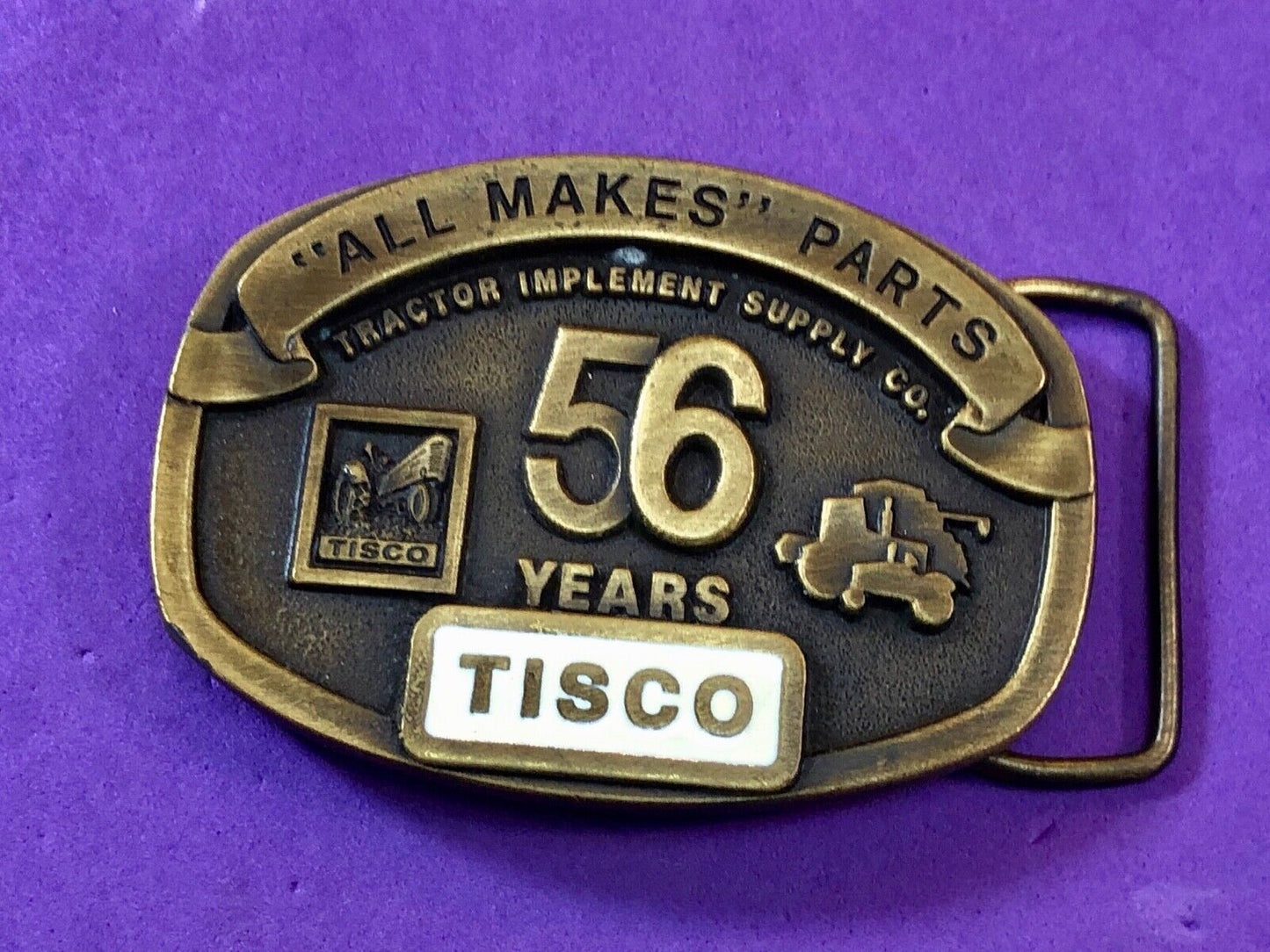 TISCO - 56 years tractor farming parts supply store advertising belt buckle