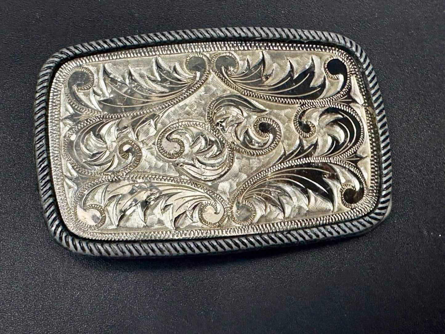 Vintage flower theme etched oval western belt buckle W/ rope border